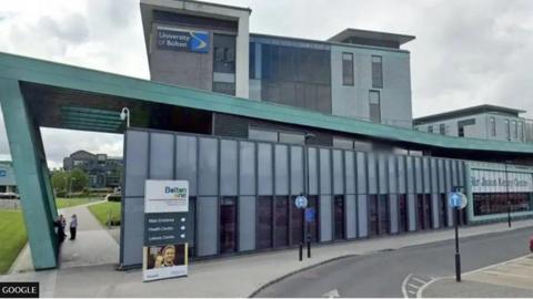 The green and grey exterior of the Sir Jason Kenny Centre at what was then called the University of Bolton.