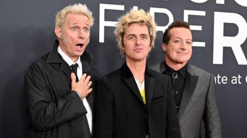 The band Green Day, made up of Mike Dirnt, Billie Joe Armstrong and Tre Cool attending the 67th Annual Grammy Awards.