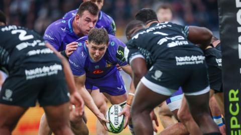 Lewis Pearson makes a move towards the tryline while playing for Exeter against Racing 92