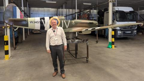 Illuminations manager Richard Williams in front of a Spitfire Illumination that is being repaired in the Lightworks factory.