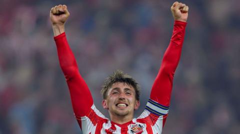 Dan Neil celebrates