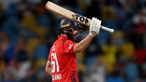 England batter Phil Salt raises his bat after hitting fifty