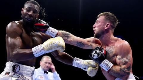 Shakiel Thompson is punched by Brad Pauls