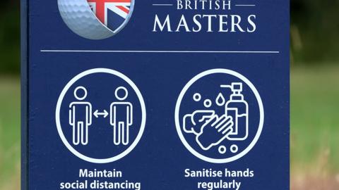 Sign reminding players to sanitise hands and obey social distance guidelines