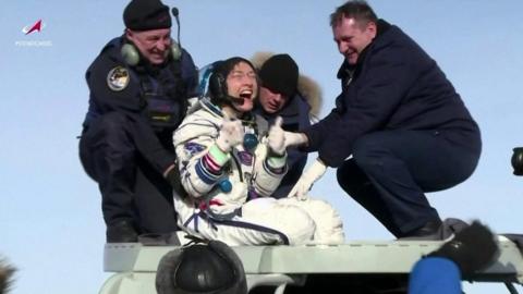 Christina Koch is lifted from the capsule