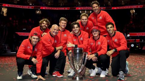 Andre Agassi and his Team World stars pose with the Laver Cup trophy
