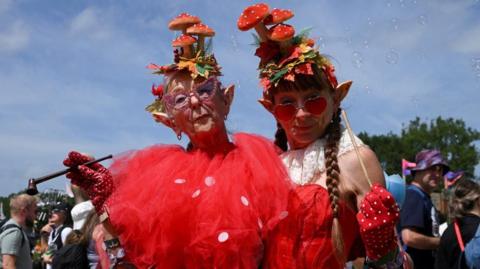 Revellers pose for a photo 