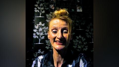 An image of Mandy Riley smiling at the camera