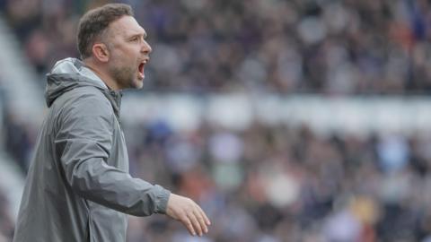 Derby County boss John Eustace shouts from the touchline 