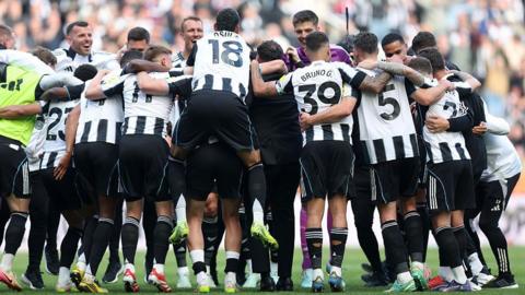 Newcastle players celebrate after full-time