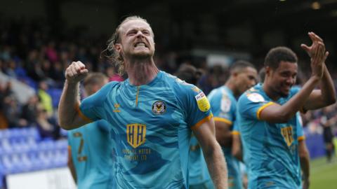 Alex Fisher celebrates Newport goal