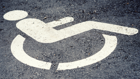 Disabled parking space marked on a road.