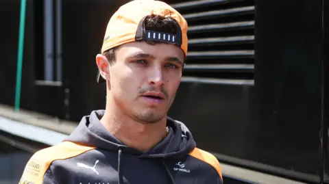 McLaren's Lando Norris, wearing a McLaren cap backwards, before the Hungarian Grand Prix