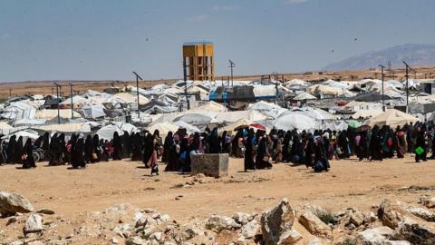 File photo showing people walking around al-Hol camp, in Hassakeh province, north-eastern Syria (18 April 2025)