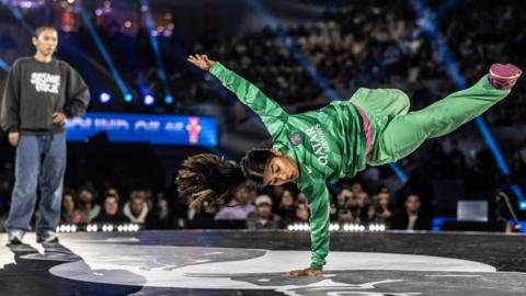 India, of the Netherlands, competes against Mono, of Kore,a during the Red Bull BC One World Final at Court Philippe-Chatrier, Roland Garros, on October 21, 2023 in Paris, France.