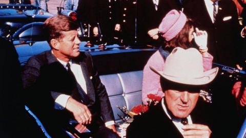 President John F Kennedy photographed in the back of a convertible with his wife on the day he was killed in Dallas in 1963.