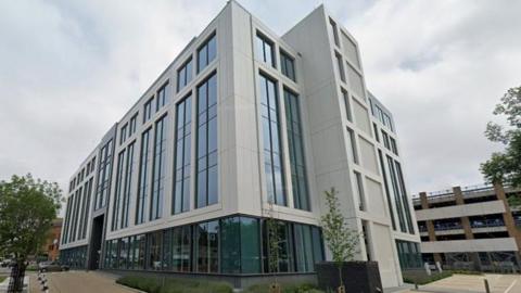 Modern council building - Slough Borough Council's HQ it has rectangular glass windows and a pale stone exterior.