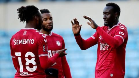 Bristol City's Famara Diedhiou (right) celebrates with team-mates after scoring from the penalty spot