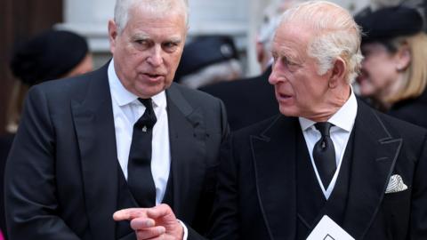 Prince Andrew and King Charles, dressed in black mourning clothes, at the funeral of the Duchess of Kent
