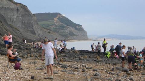 Fossil hunters on Charmouth beach