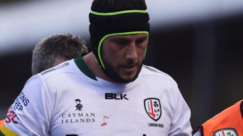 London Irish's Adam Coleman comes off the field against Saracens