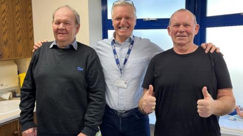 Peter Crowther, consultant surgeon Mr Michael Van Den Bossche and Mick Crowther