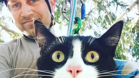 Shaun Sears with a cat he's rescued