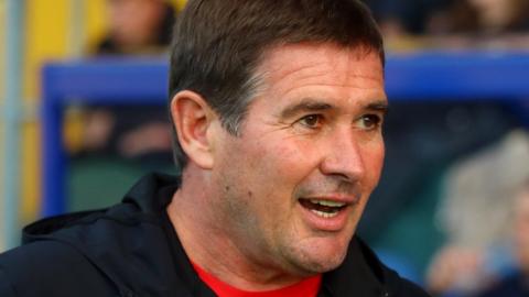 Mansfield Town boss Nigel Clough oversees the Carabao Cup win over Grimsby Town