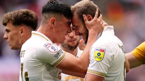 Port Vale's James Wilson celebrates scoring their side's second goal of the game with team-mate Kian Harratt (left)