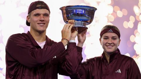 Jakub Mensik and Karolina Muchova hold the US Open trophy