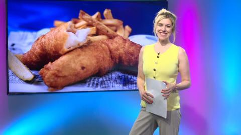 Jenny in the studio with fish and chips in the screen