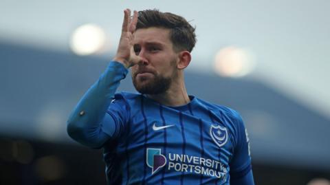 Callum Lang celebrates scoring for Portsmouth