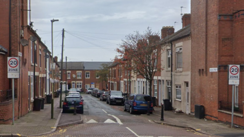 A street with terraced housing and speed humps