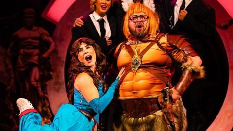 Actors playing Coleen and Wayne Rooney in a stage play in medieval dress