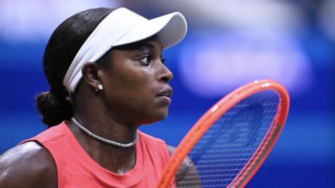 Sloane Stephens holding a tennis racquet