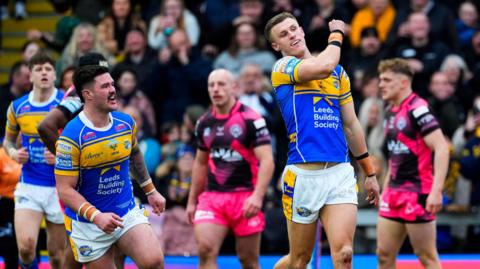 Ash Handley celebrates scoring a try against Castleford