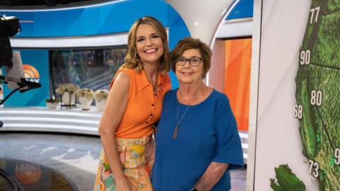 Savannah Guthrie posing for a photo with her mother Nancy in a television studio