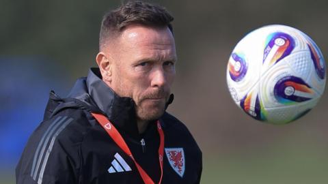 Craig Bellamy watches the ball in Wales training