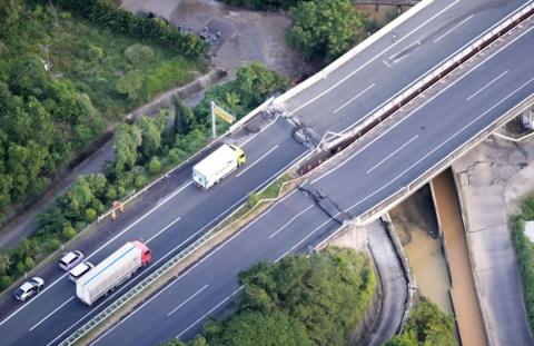 An aerial view shows the damaged Kyushu Expressway after an earthquake with a preliminary magnitude of 7.1 struck Japan's southern Kumamoto prefecture, in Yatsushiro, Kumamoto prefecture, July 28, 2026.