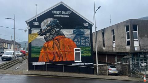 Mural showing miner at colliery