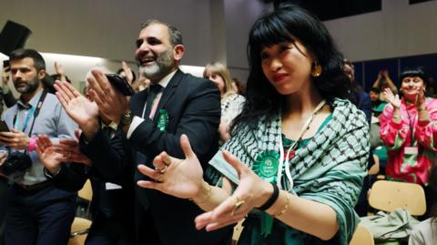 Green supporters clapping Lewisham