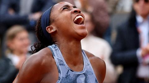 Coco Gauff yells in celebration after winning the French Open