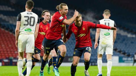 Falkirk's Aidan Nesbitt (L) celebrates scoring to make it 1-0 with teammate Calvin Miller (R) during a William Hill Championship match between Queen's Park and Falkirk at Hampden Park, on November 22, 2024, in Glasgow, 