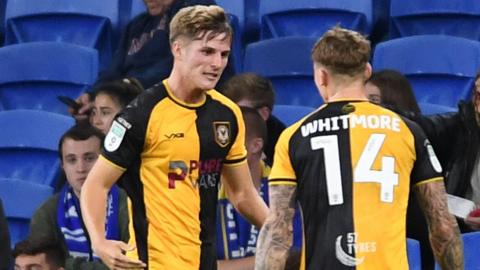 Tom Davies (L) celebrates scoring for Newport against Cardiff