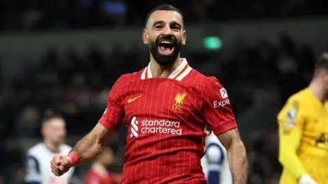 Mohamed Salah celebrates scoring against Tottenham