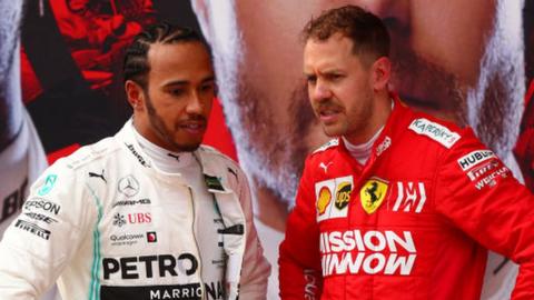 Mercedes driver Lewis Hamilton and Ferrari drive Sebastian Vettel talk after the Chinese Grand Prix