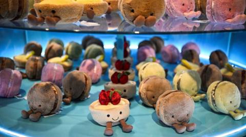 A Jellycat pastry-shaped soft toys display.