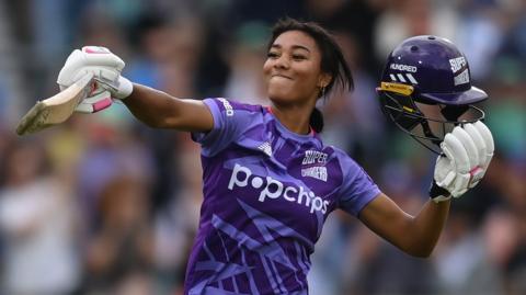 Northern Superchargers batter Davina Perrin celebrates hitting a century during a Hundred match