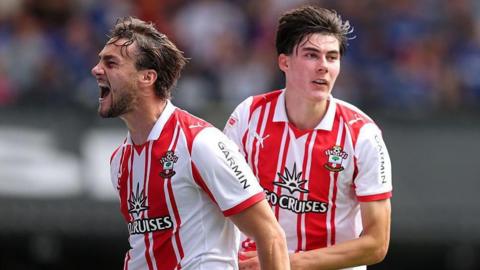 Taylor Harwood-Bellis (left) and Jay Robinson (right) celebrate after scoring an equaliser
