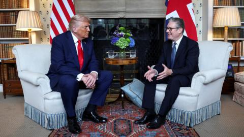 Donald Trump and Keir Starmer sit at fireplace in Chequers